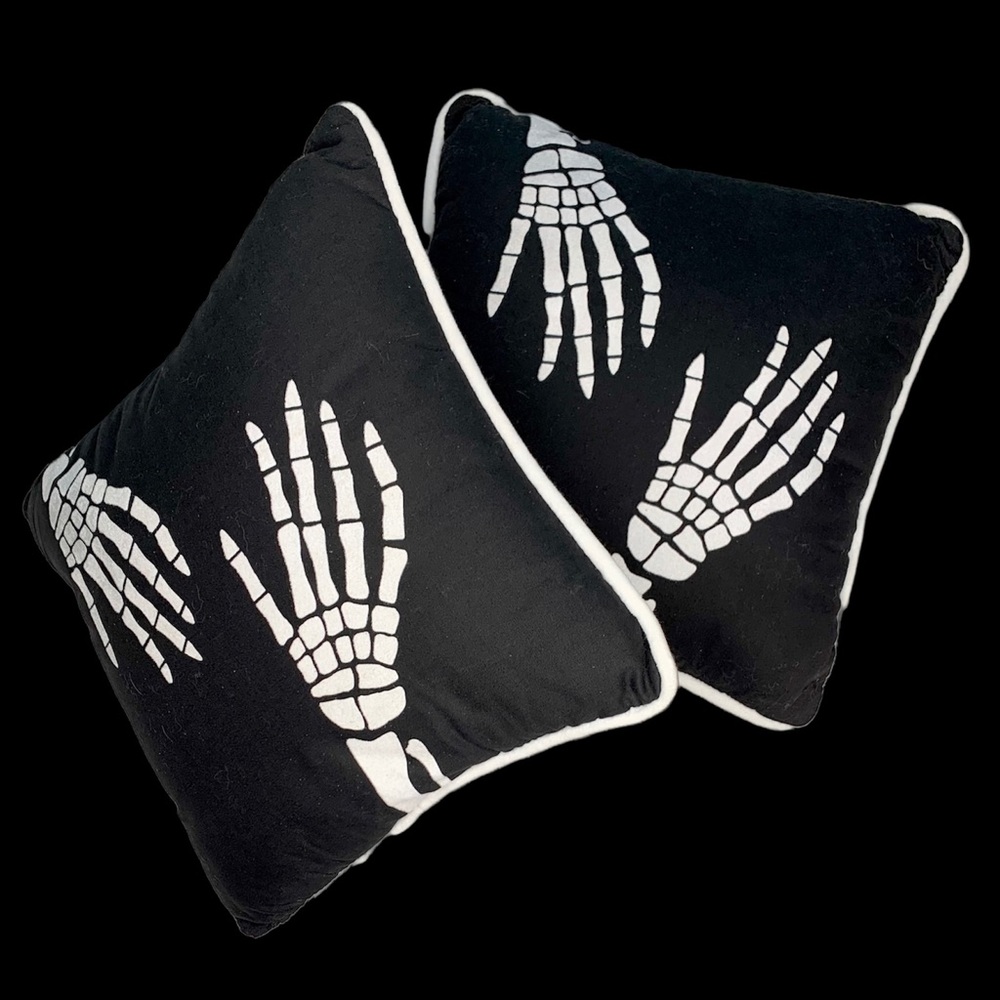2 Halloween goth skeleton hands throw pillows